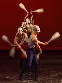 A masked club-swinging act from Circus Contraption's show, ...All Fall Down.